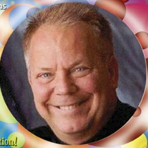 Magician smiling.